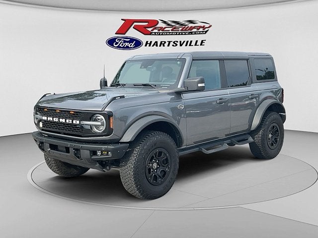 2024 Ford Bronco Wildtrak in Carbon Gry — front three-quarter view